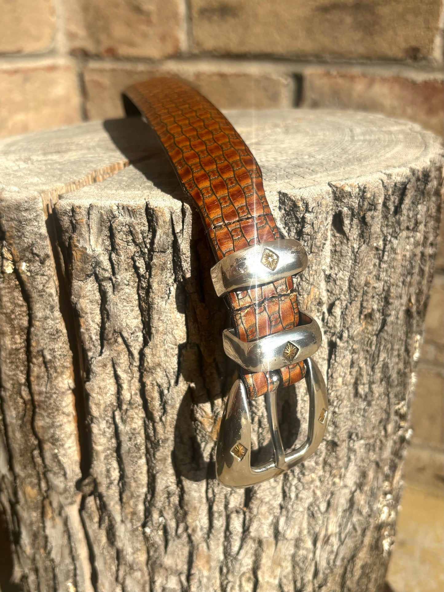Brown embossed leather / silver tone buckle belt - 42